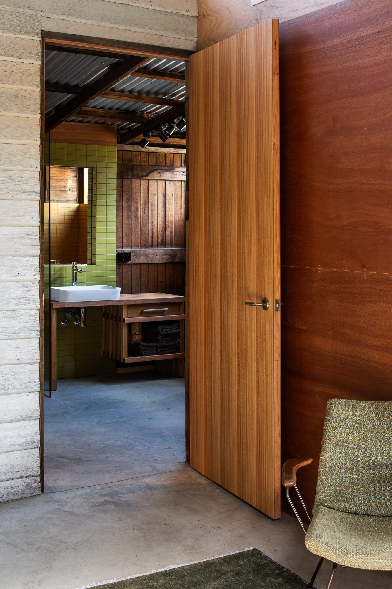 Door from living area into bathroom.