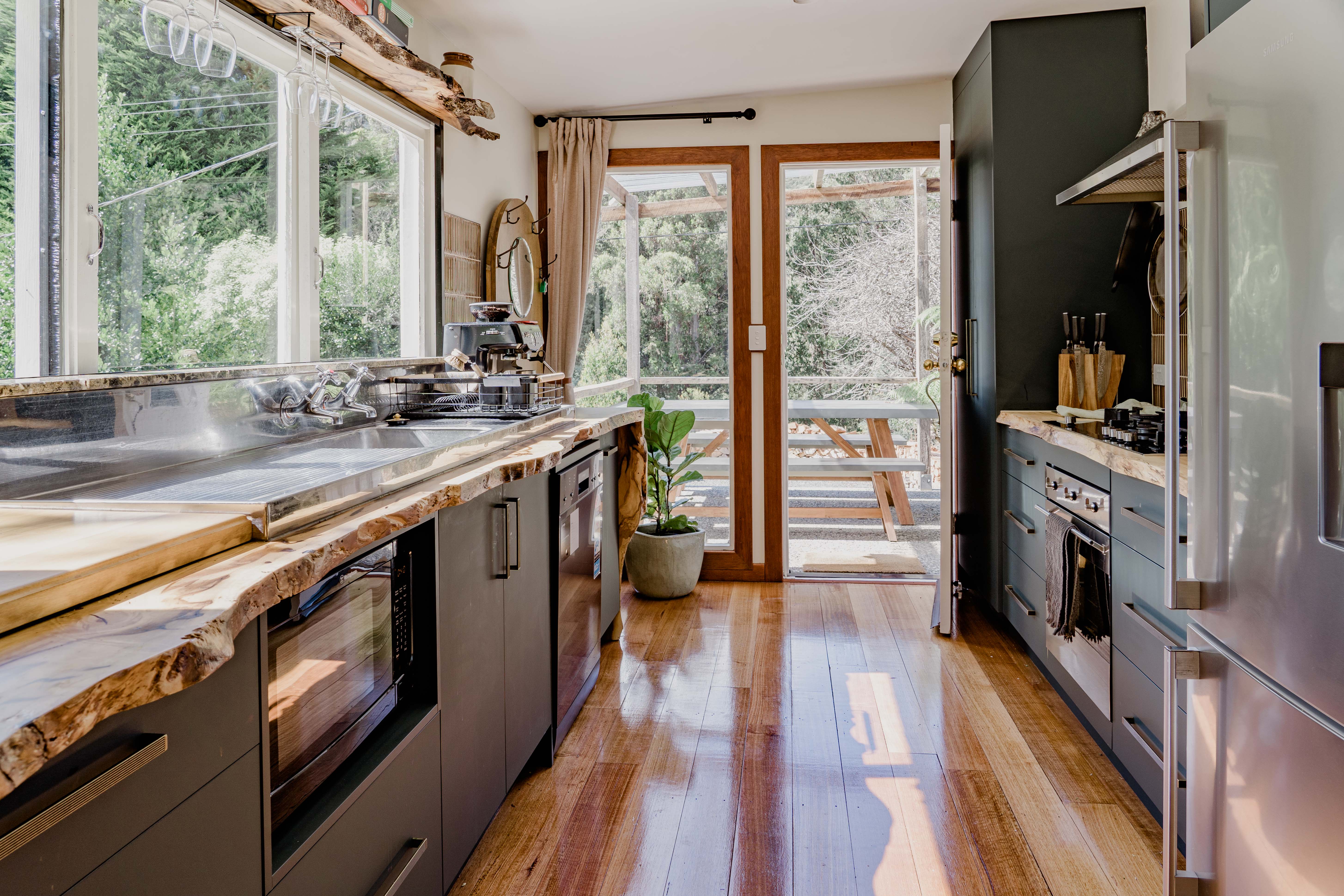Looking down the galley kitchen to the front door.